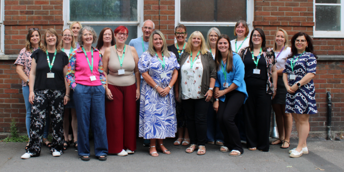 a group of people with a swindon carers centre banner