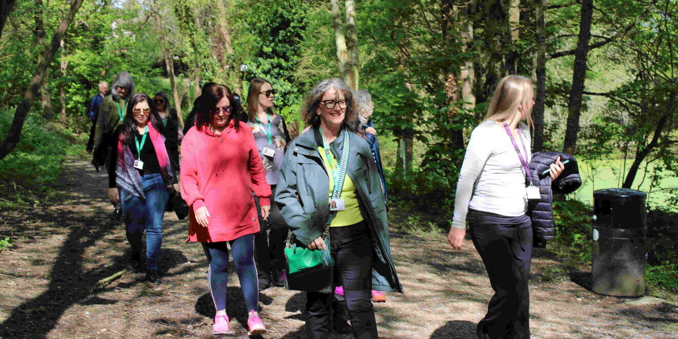 women walking through forest