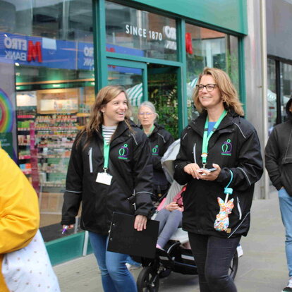 two women walking along street