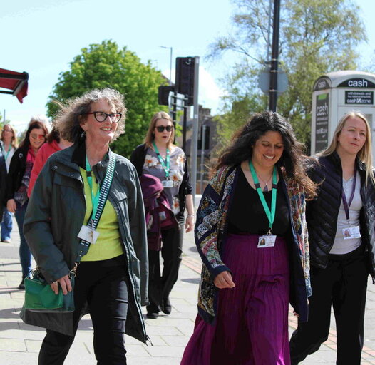 women walking along street