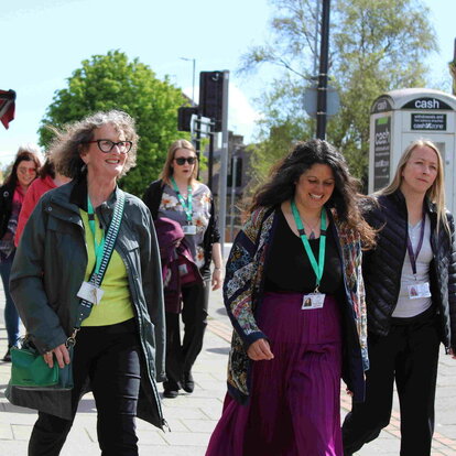 women walking along a street