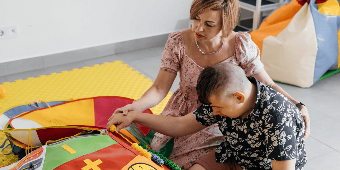 a mother and son playing