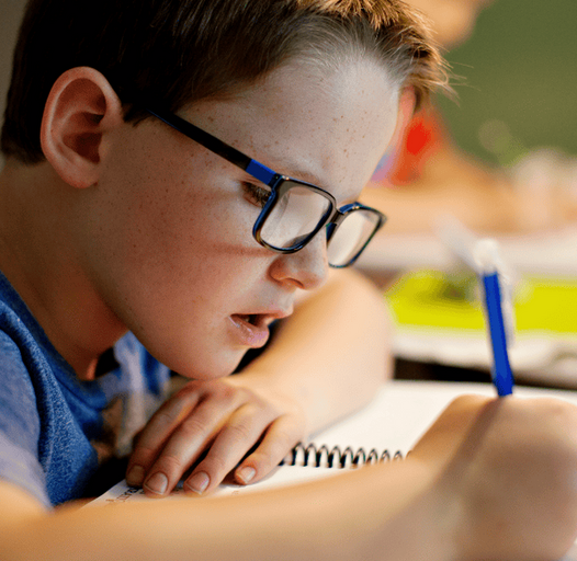 young boy doing homework